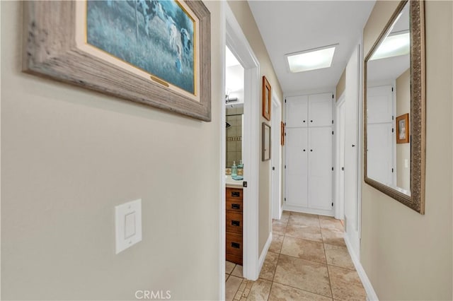 corridor with light tile patterned floors