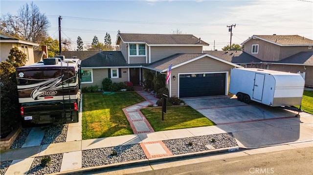 front of property with a garage and a front yard