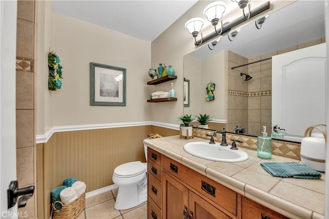 bathroom with tile patterned floors, toilet, and vanity