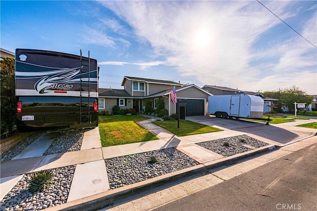 view of front of home with a garage and a front yard