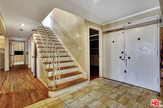 foyer entrance with hardwood / wood-style flooring