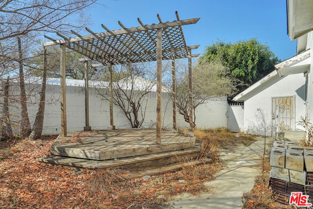 view of yard featuring a pergola and a deck