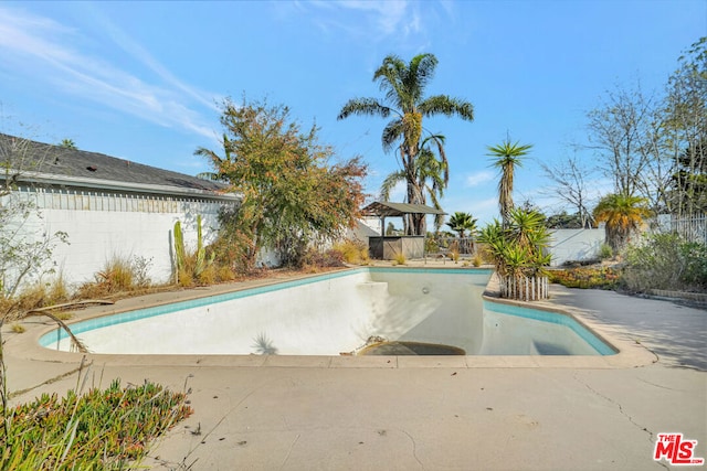 view of swimming pool with a gazebo