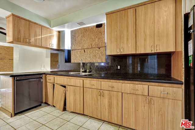 kitchen featuring tasteful backsplash, dishwasher, sink, and light tile patterned floors