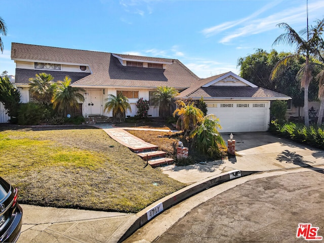 view of front of property with a garage