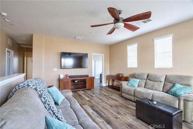 living room featuring hardwood / wood-style flooring and ceiling fan