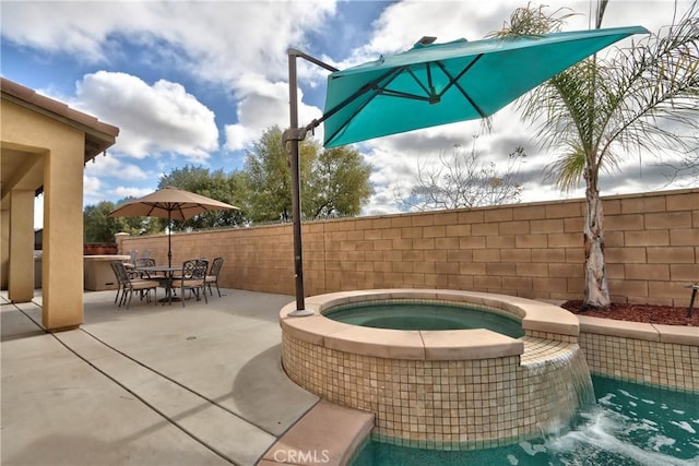 view of patio / terrace featuring an in ground hot tub