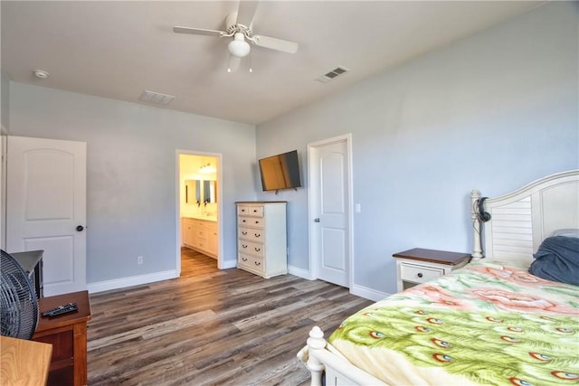 bedroom featuring ceiling fan, dark hardwood / wood-style flooring, and ensuite bath