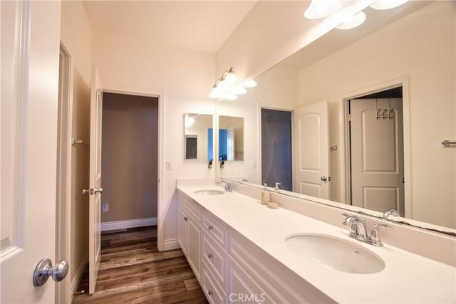 bathroom featuring wood-type flooring and vanity