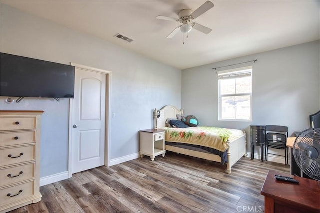 bedroom featuring dark hardwood / wood-style flooring and ceiling fan