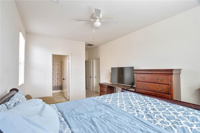 bedroom with ceiling fan and ensuite bathroom