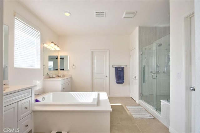 bathroom with vanity, separate shower and tub, and tile patterned flooring