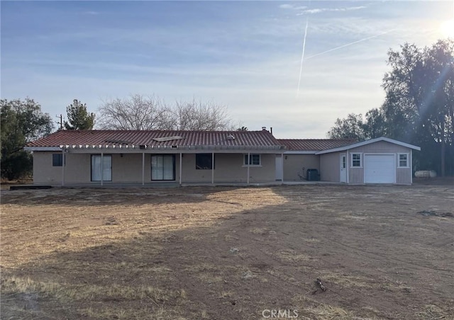 ranch-style house featuring a garage