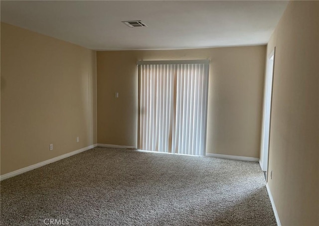 spare room with a healthy amount of sunlight and carpet flooring