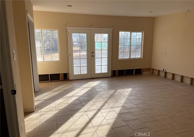 doorway featuring french doors and a wealth of natural light