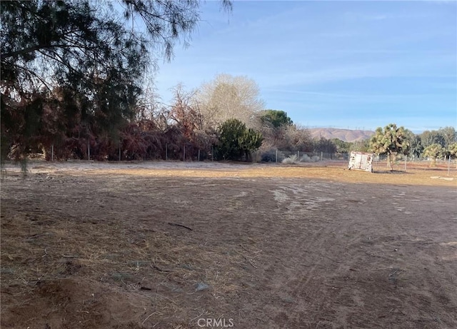 view of yard with a rural view