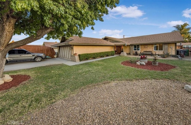 single story home with a garage and a front yard