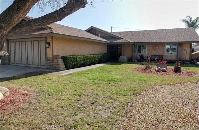 ranch-style house with a garage and a front lawn