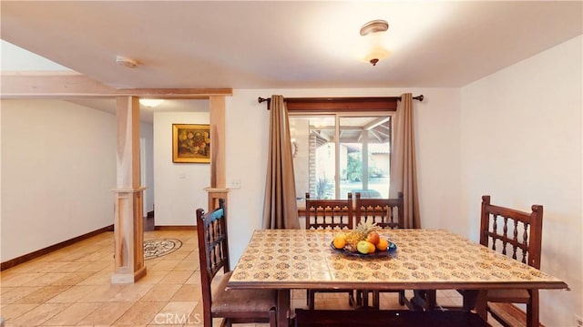 dining area with ornate columns