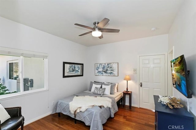 bedroom featuring ceiling fan and dark hardwood / wood-style floors