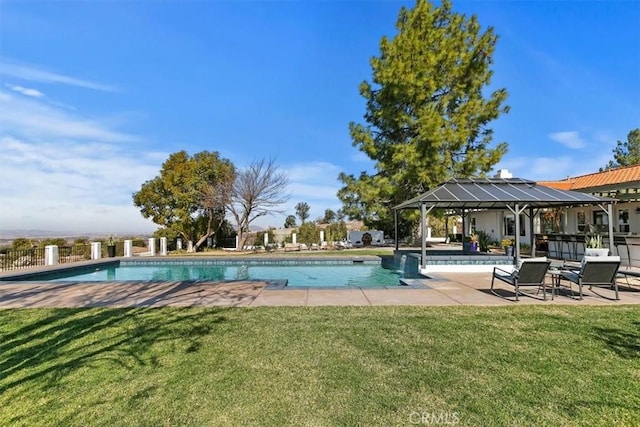 view of swimming pool with a yard and a patio area