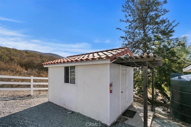 view of outbuilding with a mountain view