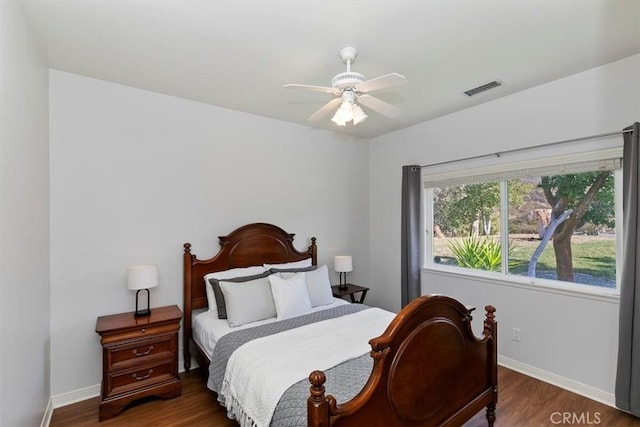 bedroom featuring ceiling fan and dark hardwood / wood-style flooring