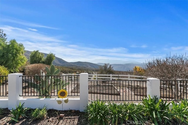 view of gate with a mountain view