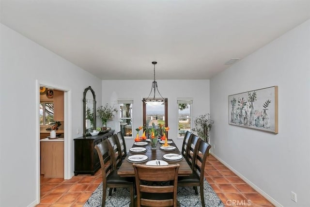 dining space featuring tile patterned floors