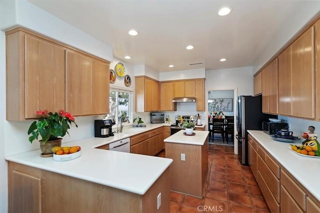 kitchen featuring sink, dishwasher, electric range, a kitchen island, and kitchen peninsula