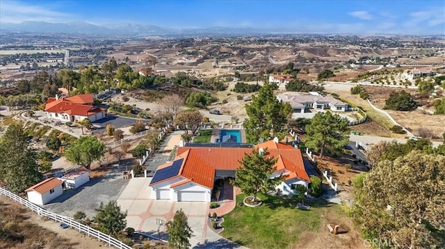 birds eye view of property with a mountain view and a residential view