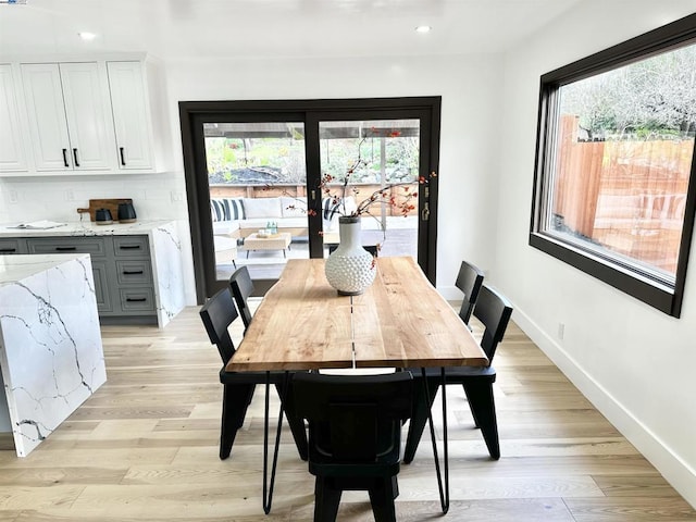 dining area featuring light wood-type flooring