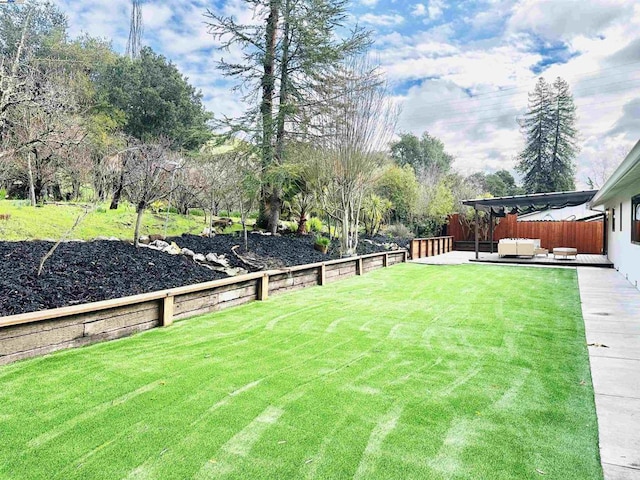 view of yard with an outdoor living space and a patio area