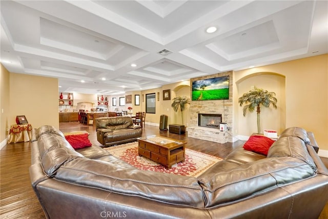 living room with hardwood / wood-style floors and a fireplace