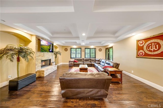 living room featuring dark hardwood / wood-style flooring, a fireplace, and coffered ceiling