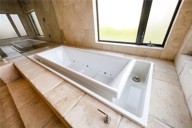 bathroom featuring tiled bath