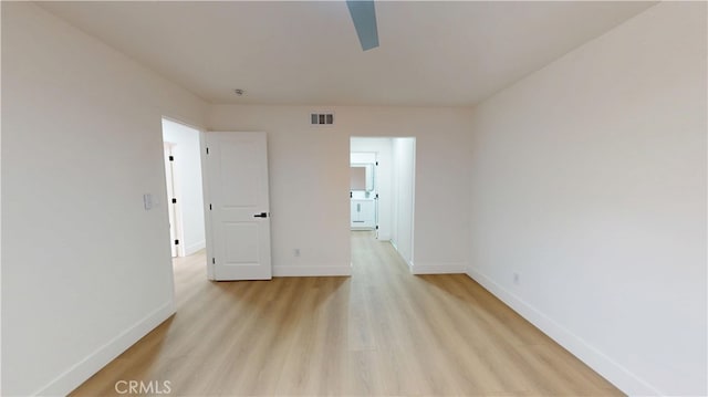 spare room featuring light hardwood / wood-style floors