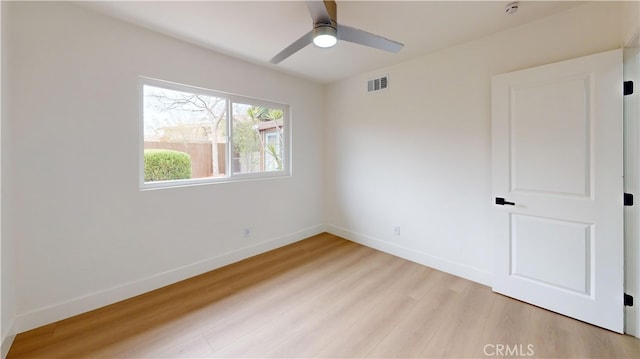 spare room featuring ceiling fan and light wood-type flooring