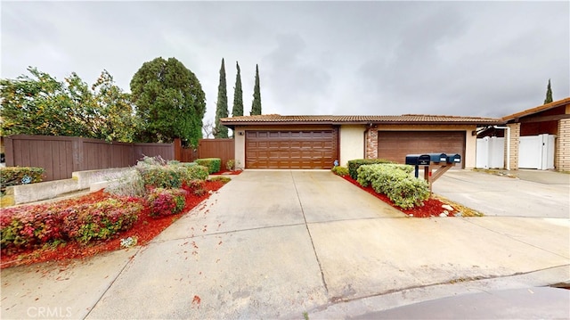 ranch-style home featuring a garage