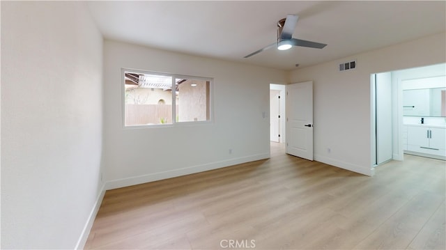 unfurnished bedroom with ceiling fan and light wood-type flooring