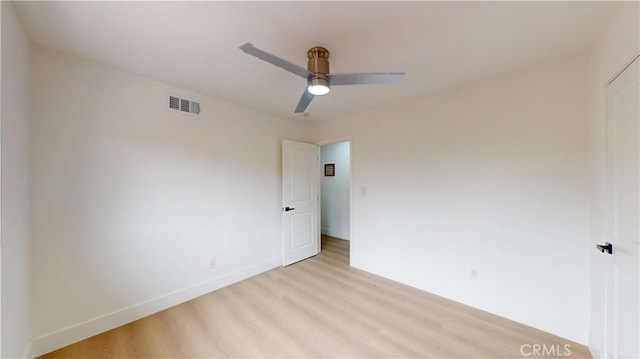 unfurnished room featuring light hardwood / wood-style flooring and ceiling fan