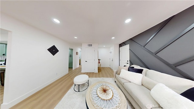 living room with light hardwood / wood-style floors