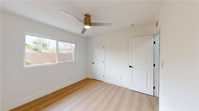 unfurnished bedroom with ceiling fan and light hardwood / wood-style floors