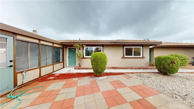 ranch-style house with a patio area