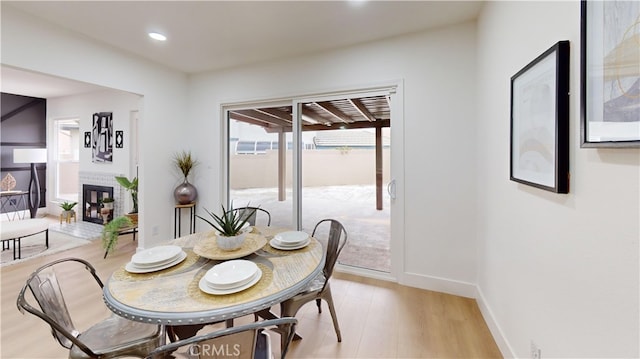 dining area with light hardwood / wood-style floors