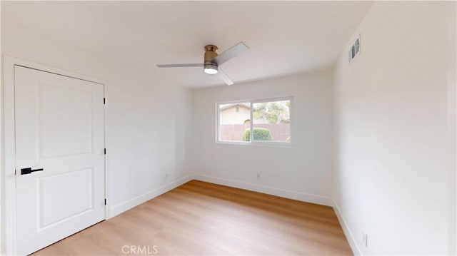 spare room featuring ceiling fan and light hardwood / wood-style flooring