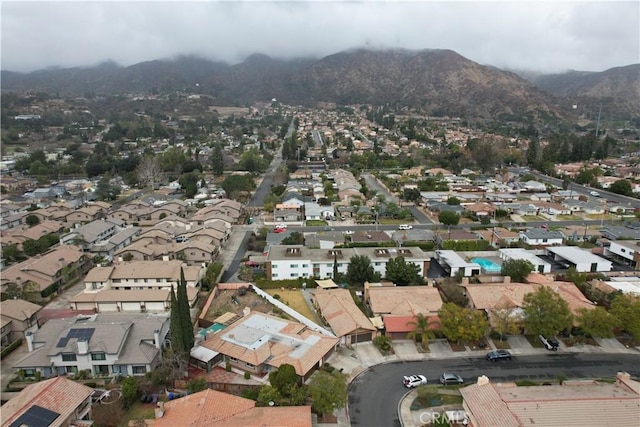 birds eye view of property featuring a mountain view