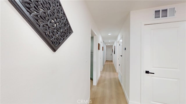 hallway featuring light hardwood / wood-style flooring