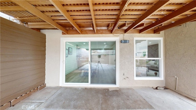 doorway to property featuring a patio