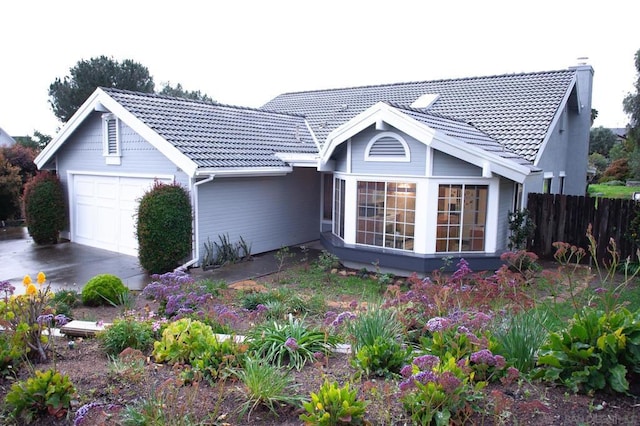 back of house featuring a garage